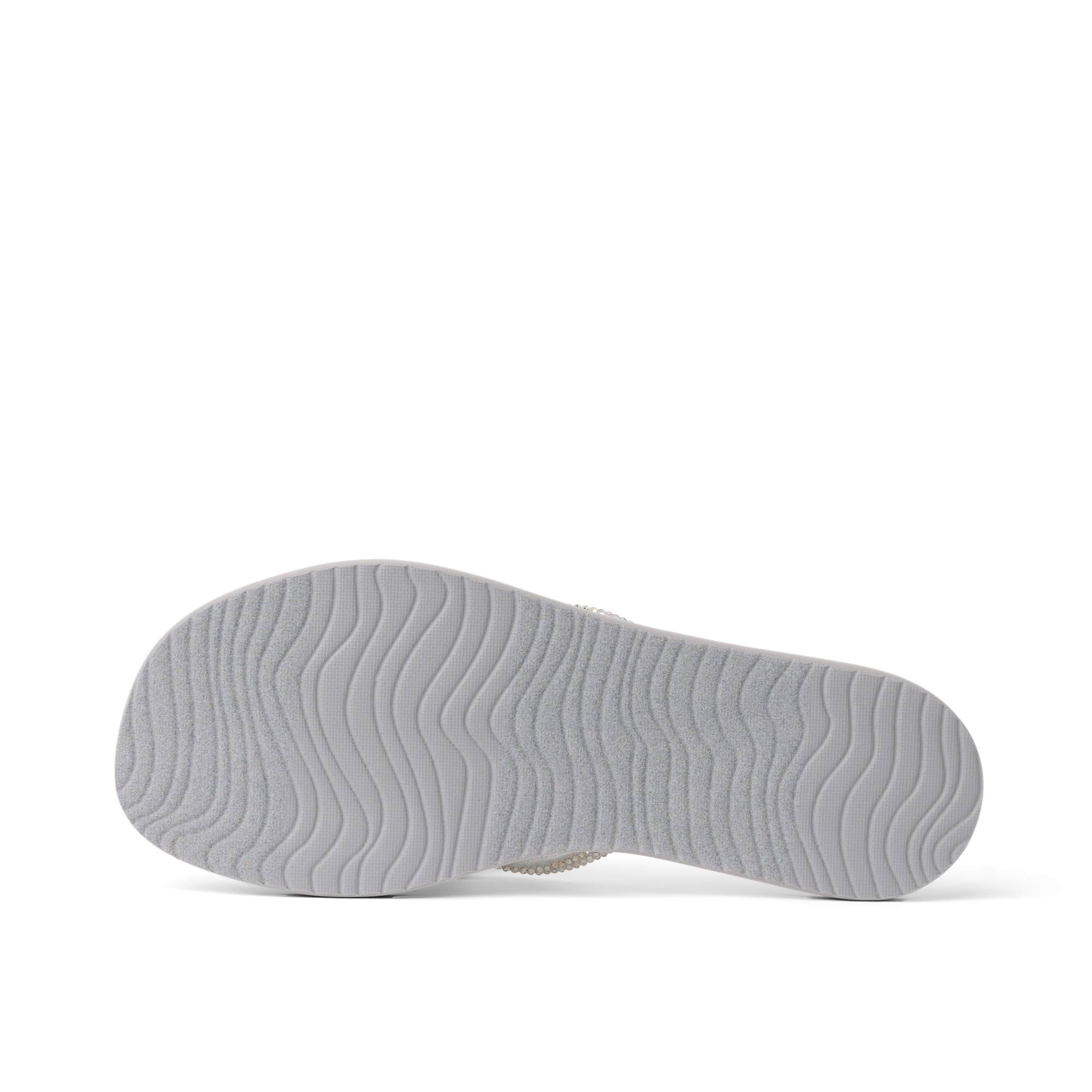 Bliss Bling Fling showing bottom sole facing up, lightweight durable sandal with surf-inspired wave tread for everyday comfort