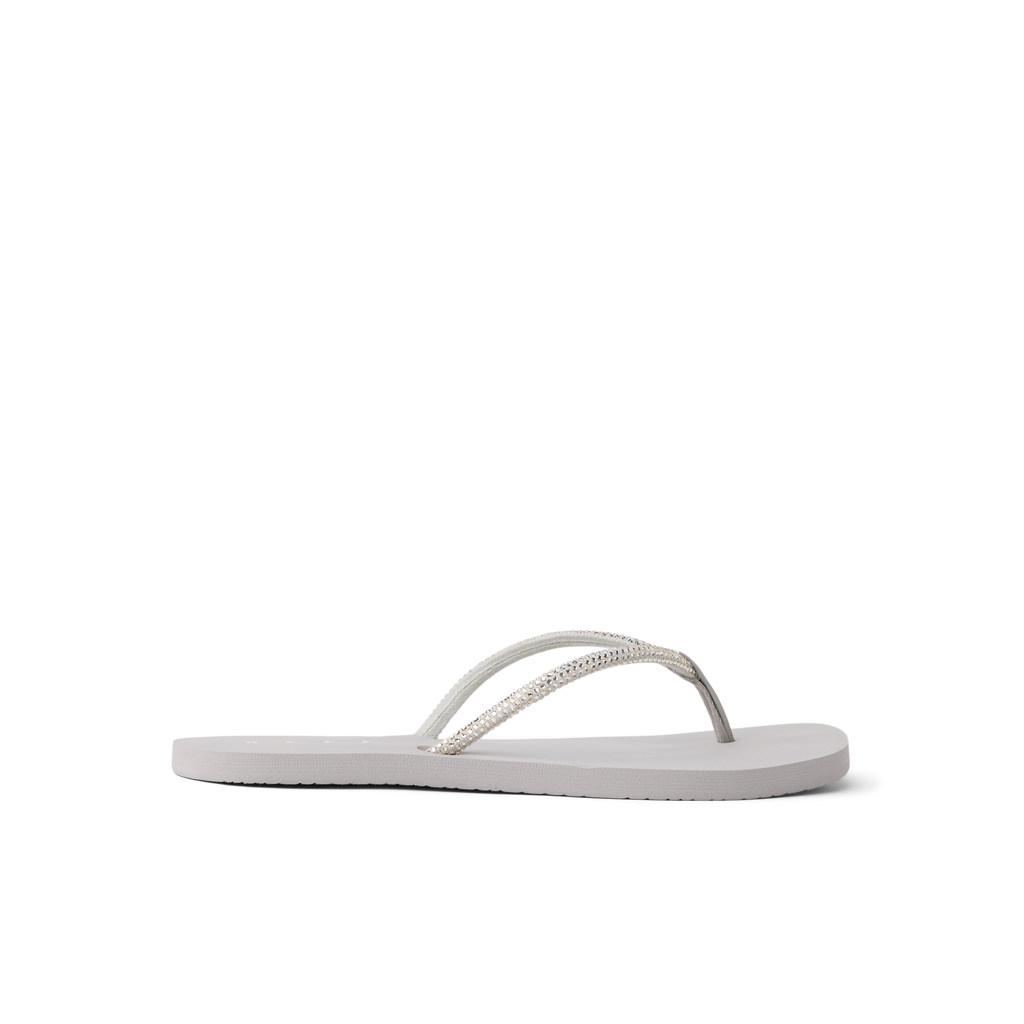 Bliss Bling Fling women's silver sandals facing left, close-up side view, beach-inspired comfort design with arch support.