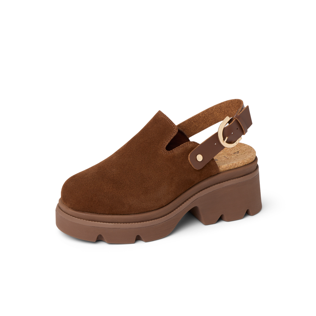 Vista Luxe Solene brown suede clog facing left with platform sole, adjustable buckle, and structured arch support heel close-up.