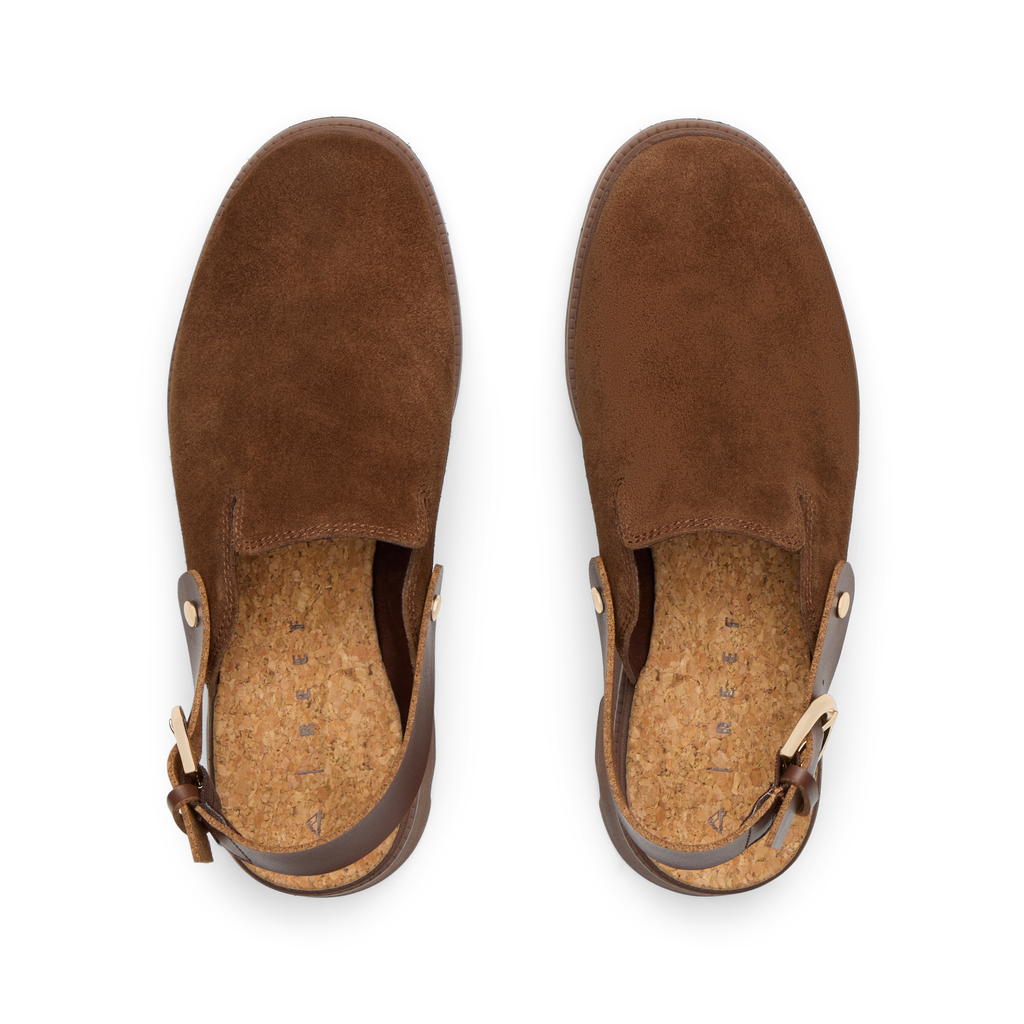 Top-down view of brown suede Vista Luxe Solene clogs facing upward, featuring adjustable buckle straps and cushioned footbeds.