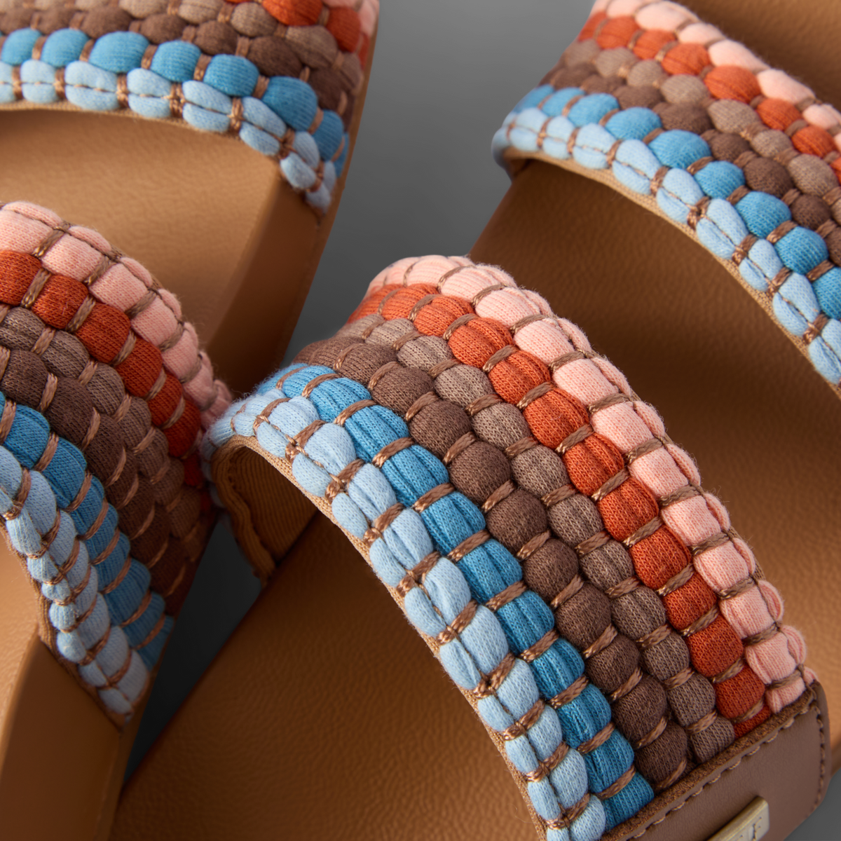 Close-up of top straps on Cushion Vista sandals facing upward, featuring woven beach-inspired comfort and arch support.