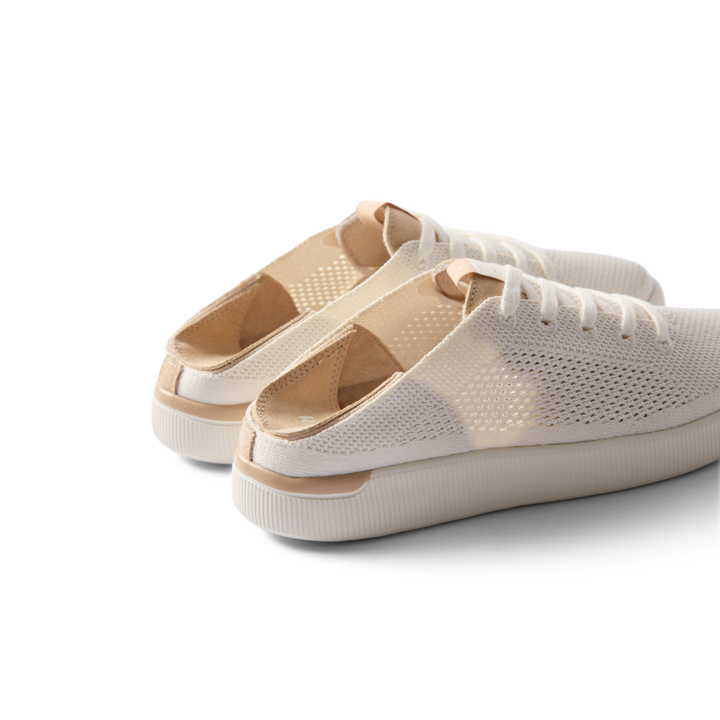 Reef Neptune women's white champagne breathable slip-on sneaker facing left, showing heel and side view