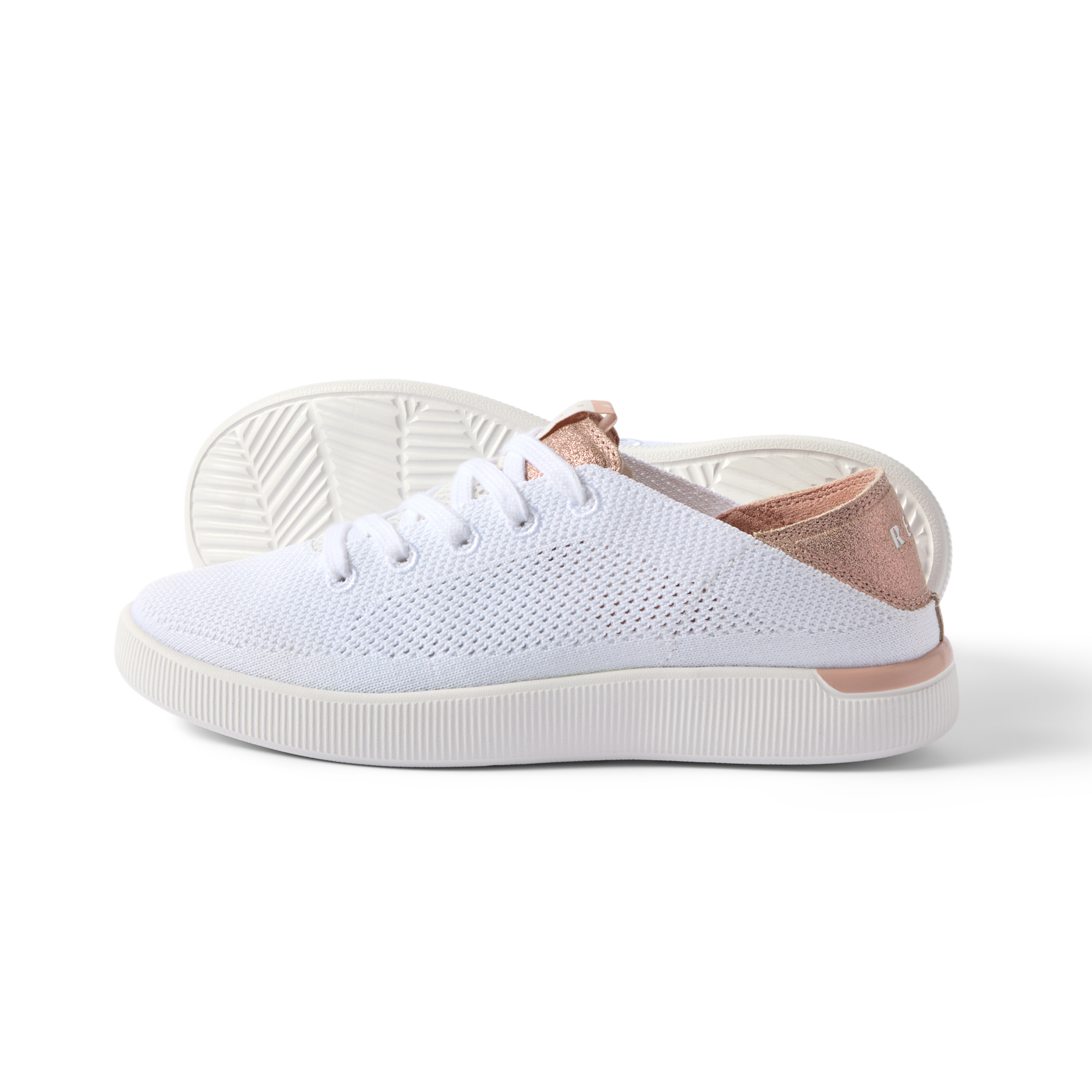 Reef Neptune white and rose gold women's sneaker facing right, showing side and sole, lightweight and breathable design.