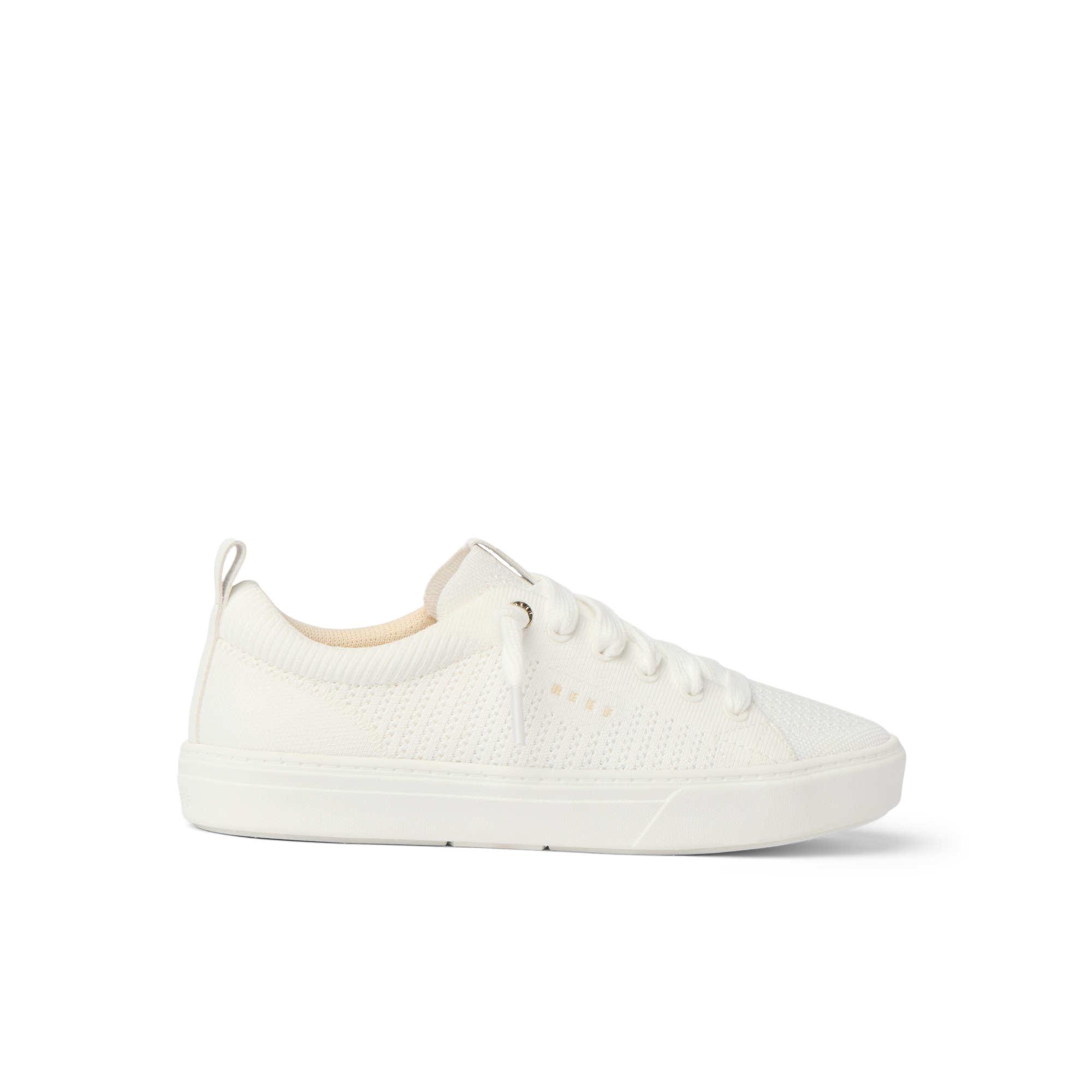Side view of a white Lay Day Lite sneaker for women, featuring lightweight, water-friendly materials and anatomical arch support.