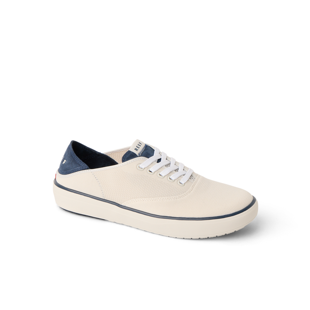 Neptune Lido men's sneaker facing left, cream and navy, featuring comfort cushioning and anatomical arch support.