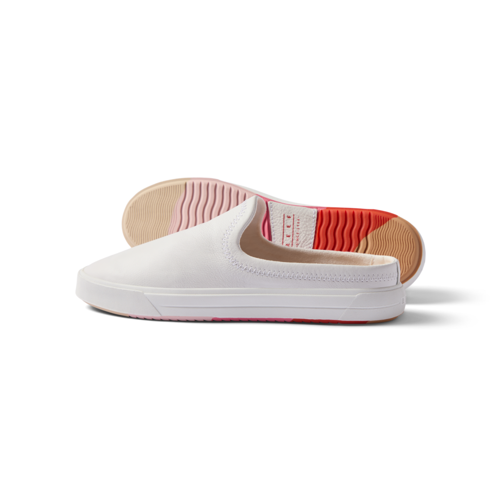Coastal Breeze women's white slip-on shoe facing left with heel view showing water-friendly sole and arch support.