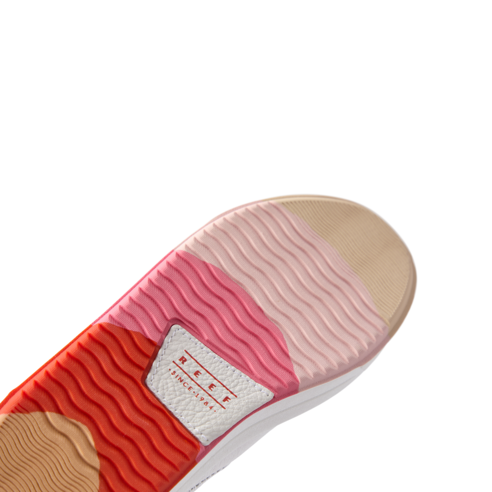 Coastal Breeze women's shoe sole facing upward, showing wave-patterned water-friendly outsole with REEF branding.
