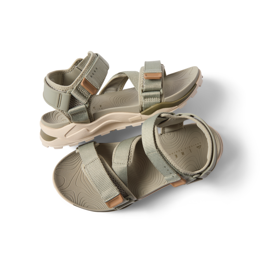 Top view of men's Cross-Shore sandal in tan with adjustable straps, cushioned sole, and arch support facing right