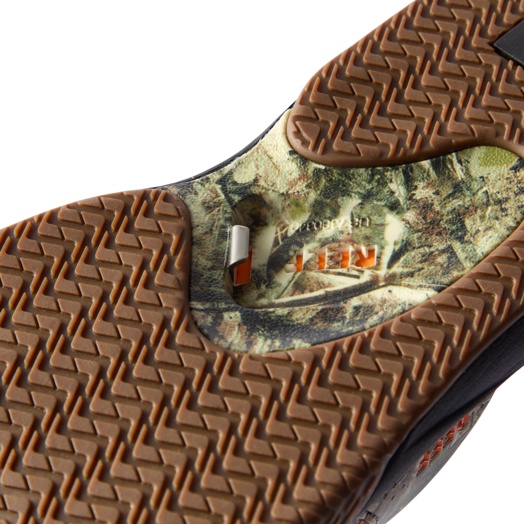 Close-up of the rubber sole on the Fanning men's shoe facing upward, featuring extra cushioning and camouflage design.
