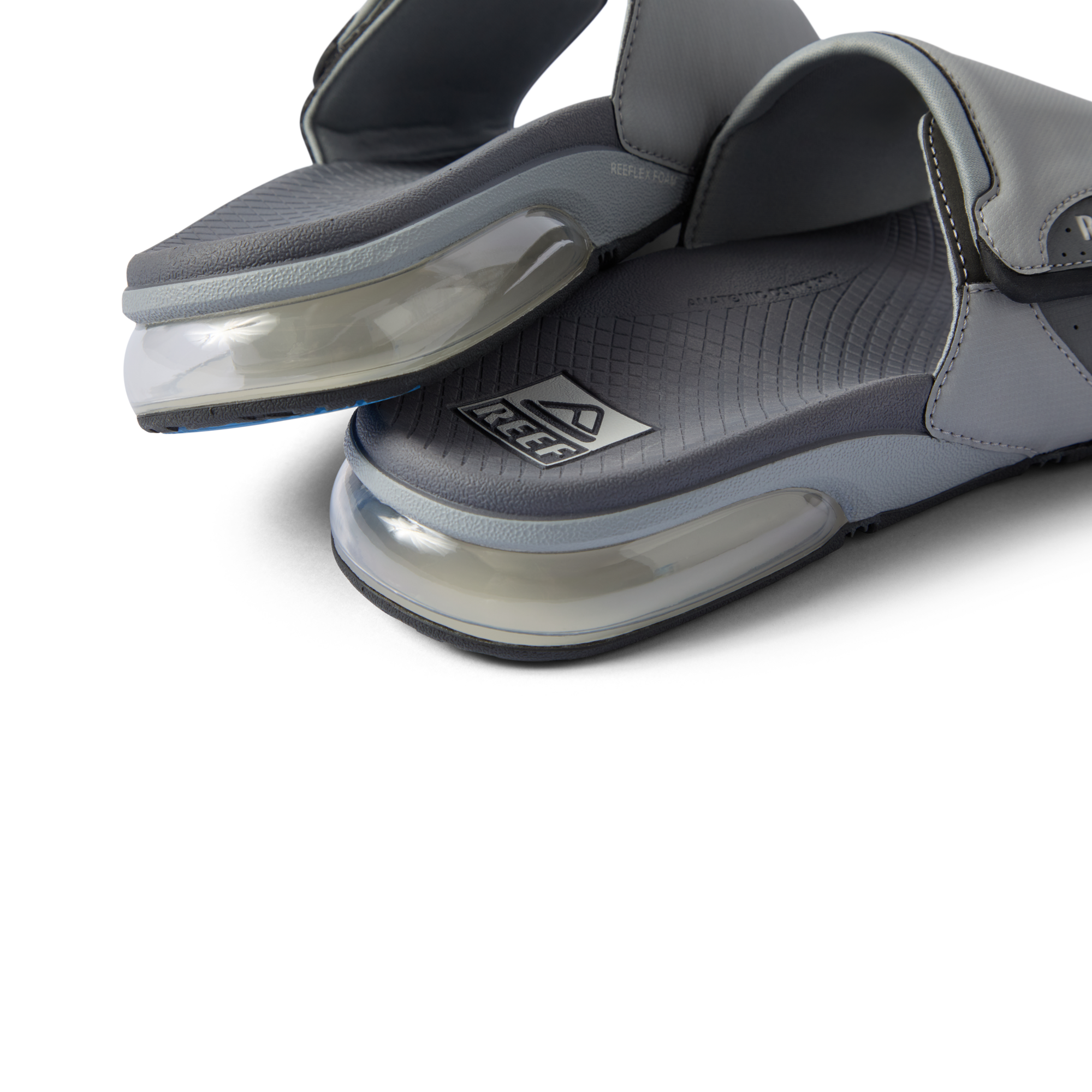 Fanning + Slide close-up of grey footbed and oversized airbag heel cushioning showcasing REEF's water-friendly comfort design