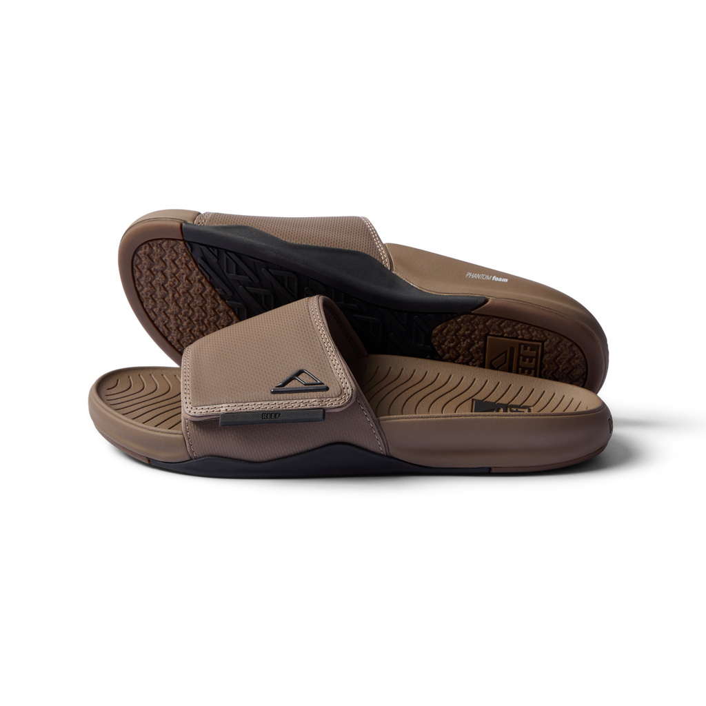 Phantom Slab men’s sandals in fossil black facing right showing footbed and top strap close-up, beach-inspired comfort footwear.