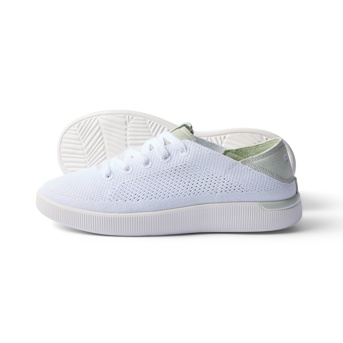 Reef Neptune women's white and dusty sage sneaker facing right, breathable knit upper, cushioned sole, beach-inspired comfort.
