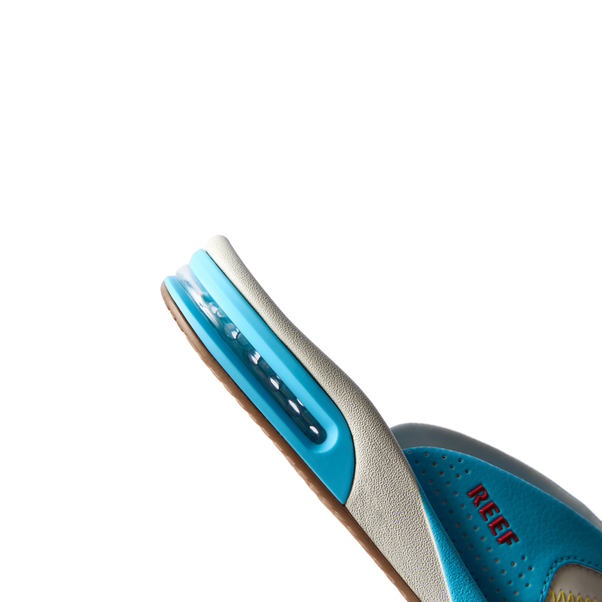 Fanning men's aqua blue sneaker facing left, showing side profile with cushioned arch support and water-friendly design.