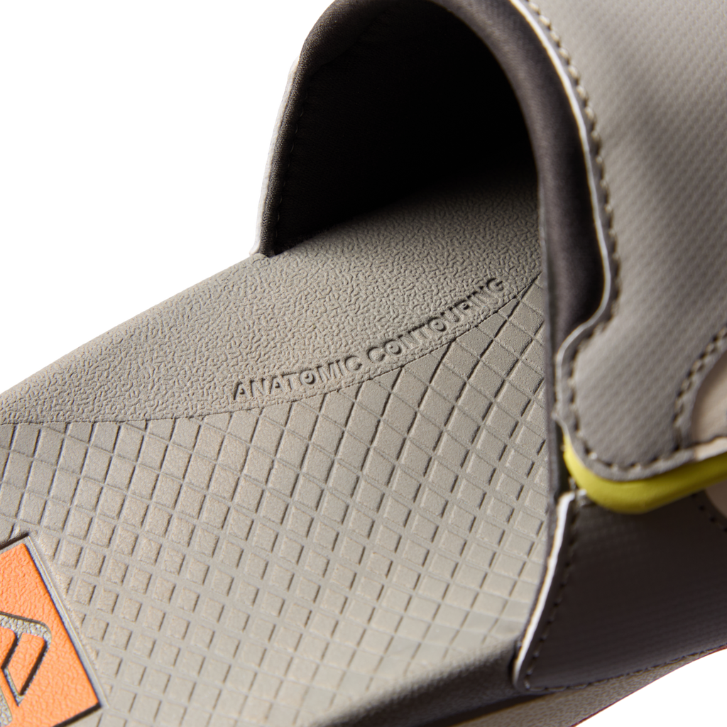 Close-up of the footbed and strap of the grey Fanning + Slide facing left, showcasing anatomical arch support and cushioning.