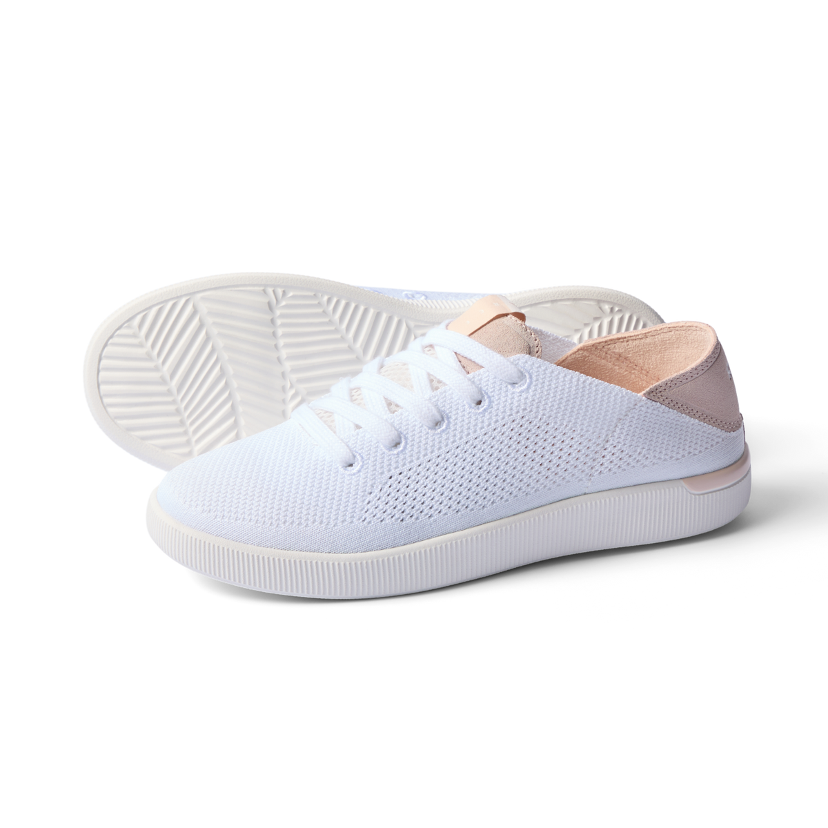 Reef Neptune women's white and blush sneaker facing right with breathable knit upper and cushioned sole for beach comfort.