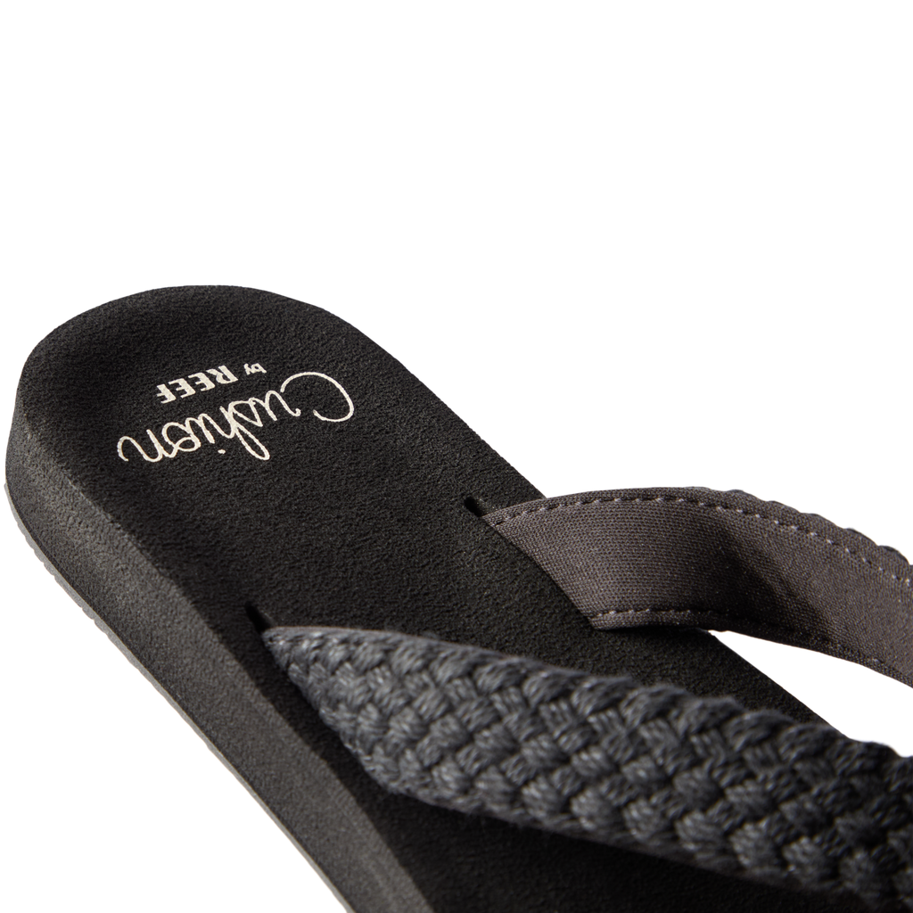 Close-up of the left-facing Baja Maria sandal showing black braided straps and cushioned arch support for comfort.