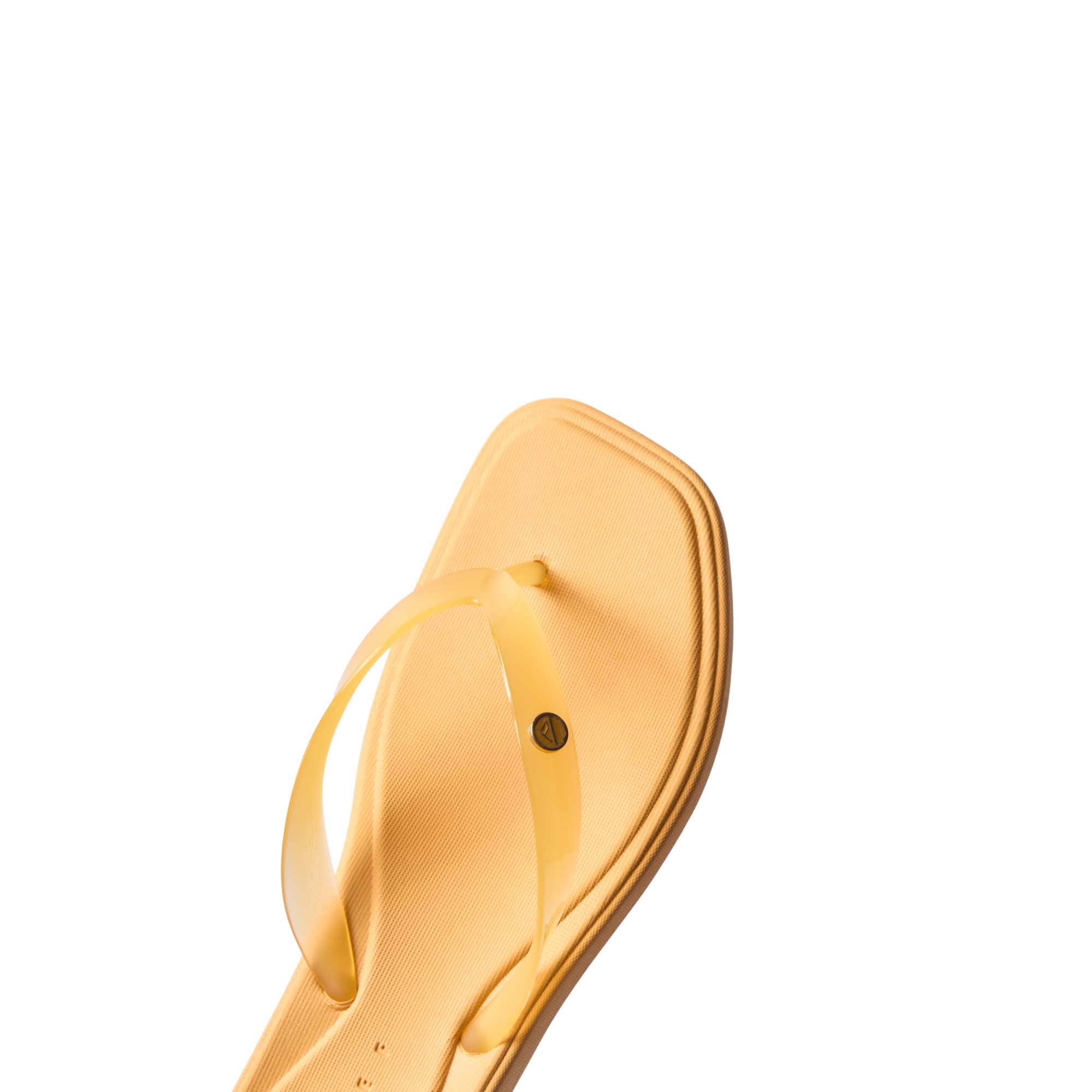 Close-up of the front upper and square toe of a yellow Solaye flip-flop, water-friendly and comfort-focused footwear.