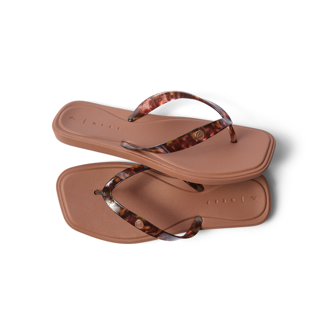 Solaye women's flip flops with tortoise shell straps, top view showing cushioned footbed and anatomical arch support.