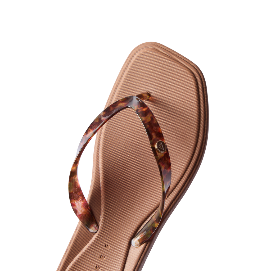 Solaye women's sandal facing upward with tortoise shell straps, cushioned footbed, and anatomical arch support for comfort.