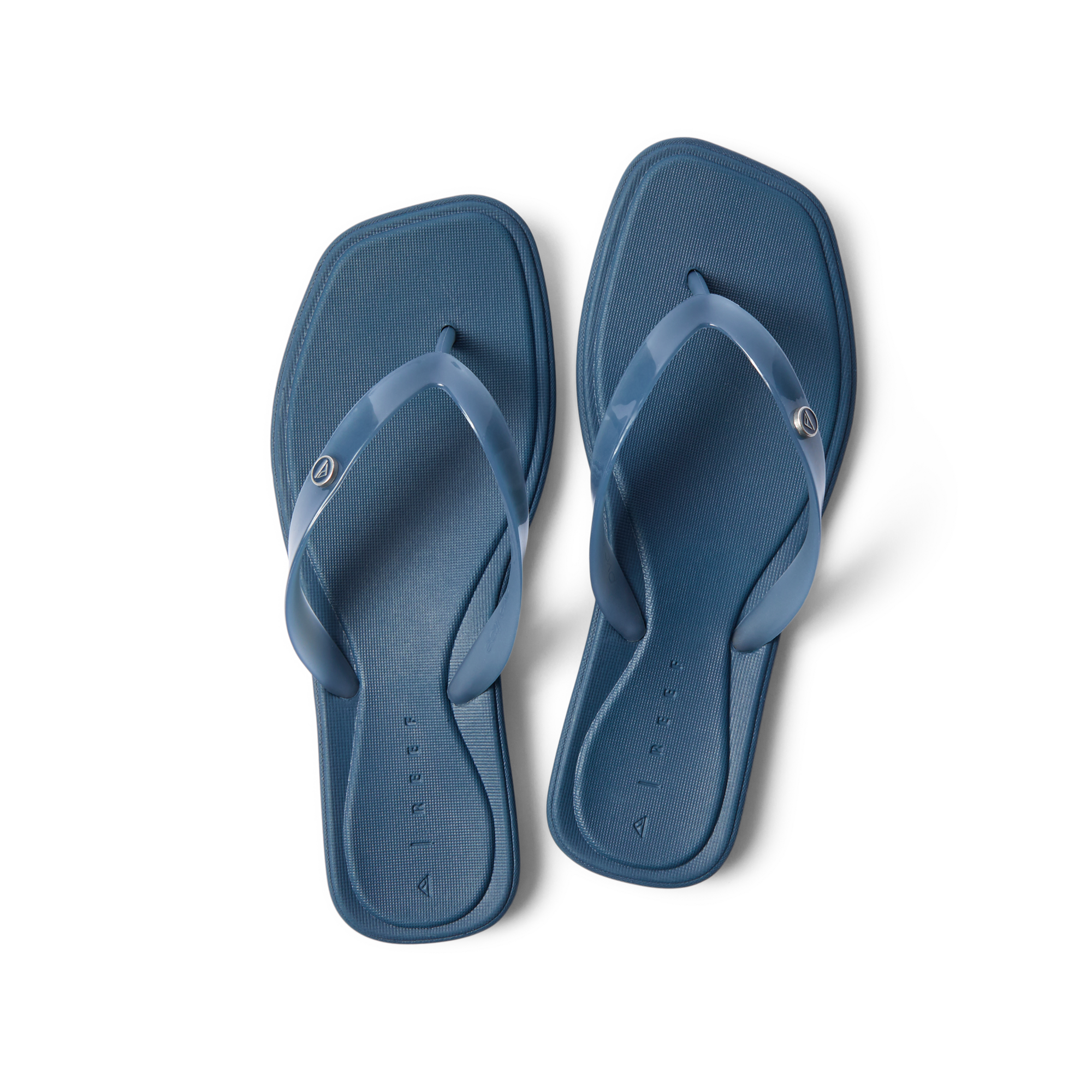 Solaye women's navy blue flip flops facing upward, featuring soft cushioning and anatomical arch support for beach comfort.