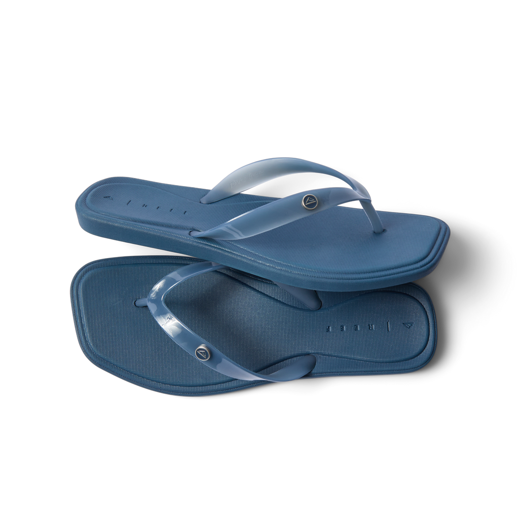 Solaye women's navy blue flip flops top and side view, surf-inspired comfort with cushioned arch support.