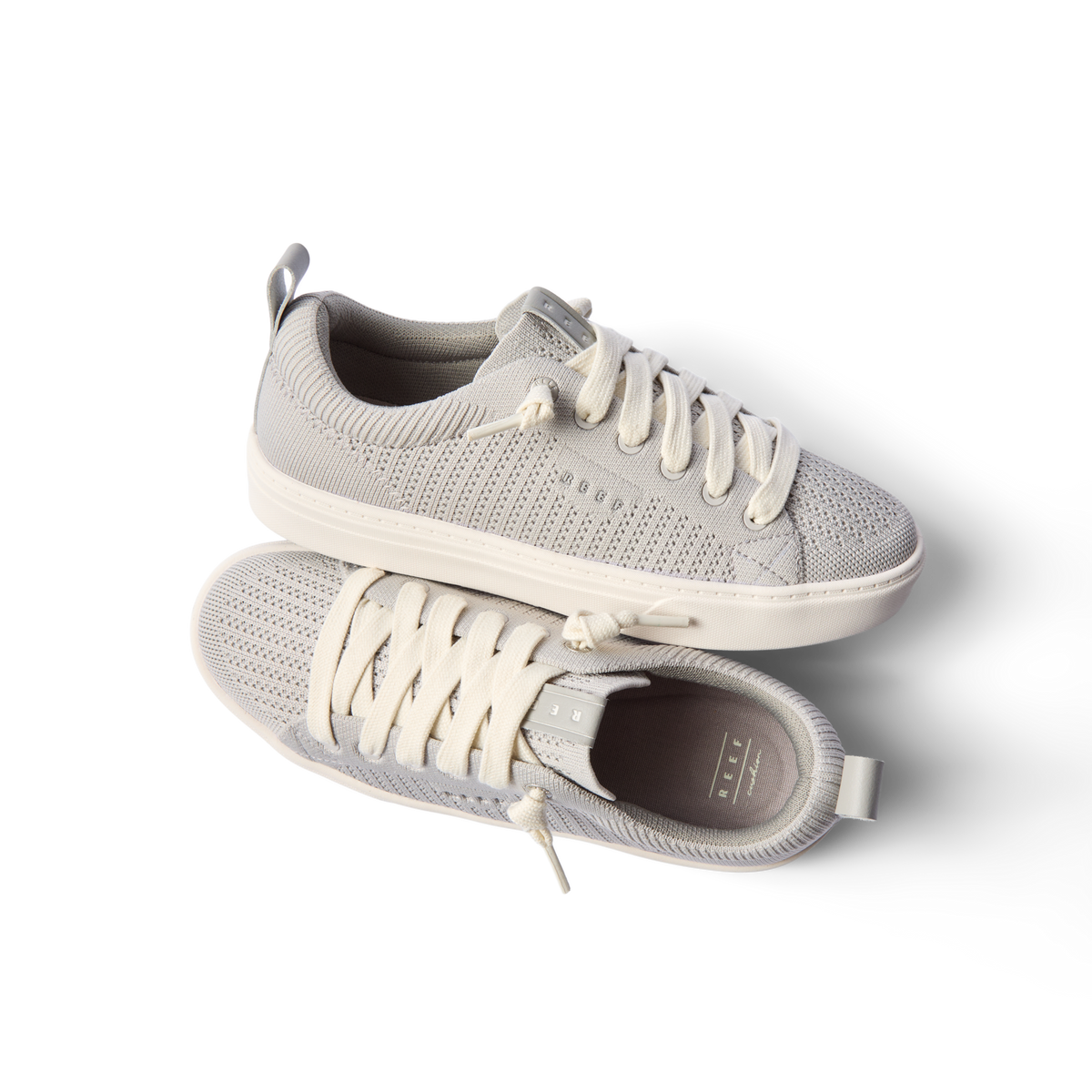 Lay Day Lite women's light gray sneakers top and side views showing knit upper, cushioned sole, and anatomical arch support