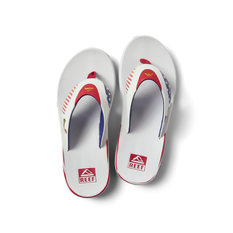 Fanning men's white flip flops facing up, beach-inspired with anatomical arch support and soft cushioning by REEF.