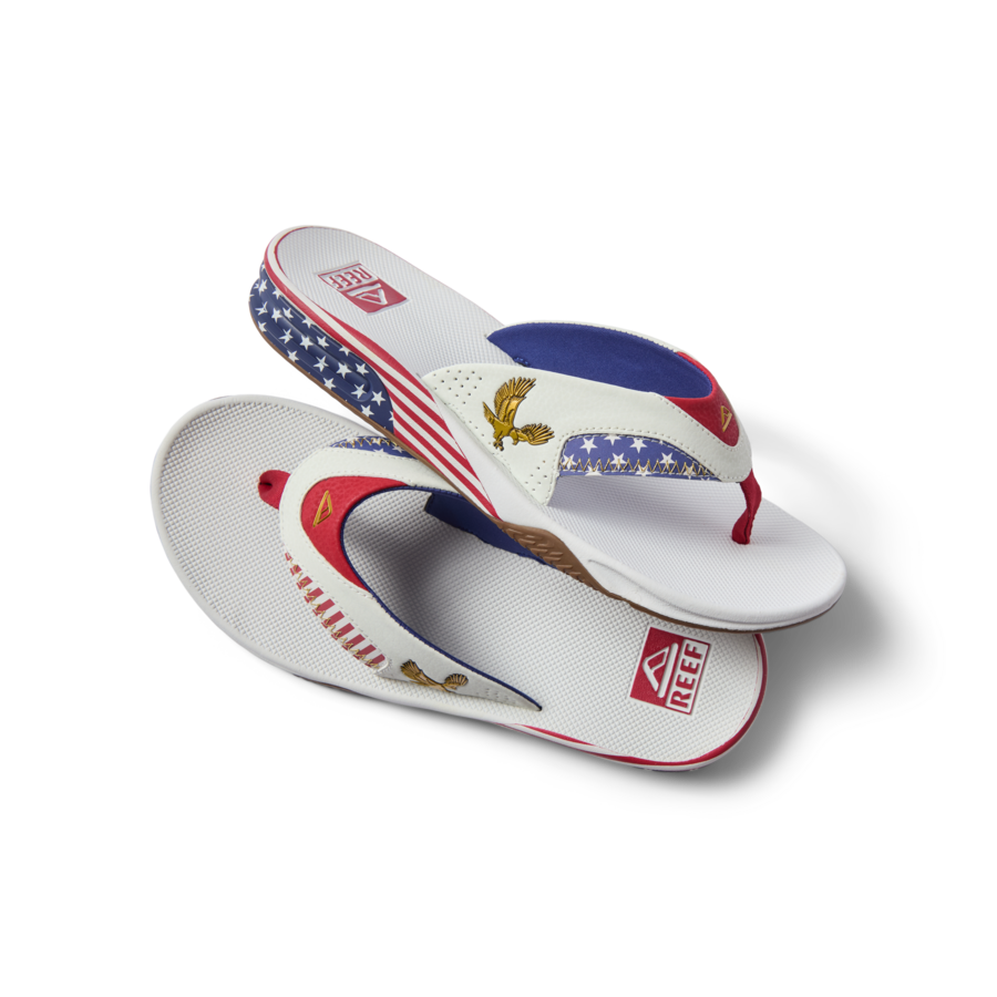Fanning men's sandals facing right, close-up on the footbed with American flag pattern and golden eagle details