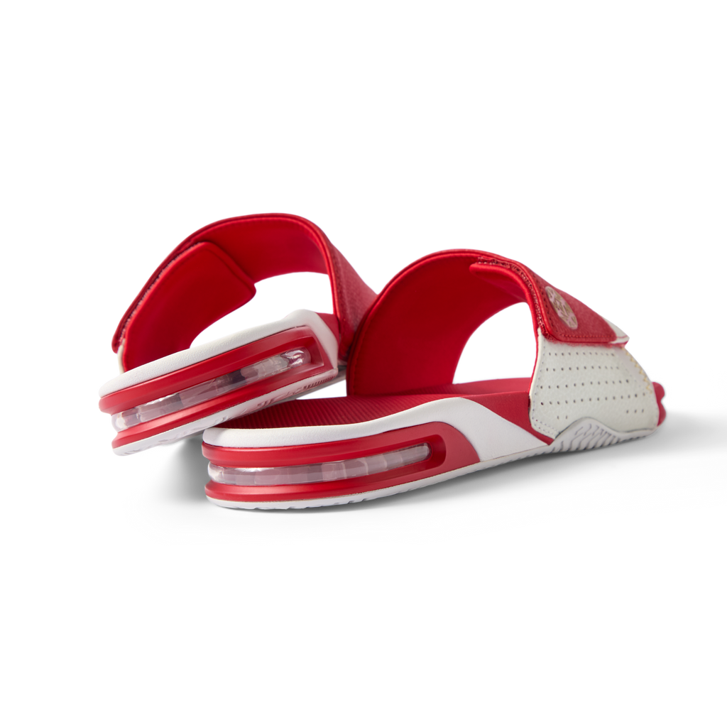 Fanning Slide facing back right, men's red and white water-friendly sandal with cushioned EVA footbed and airbag heel for comfort.