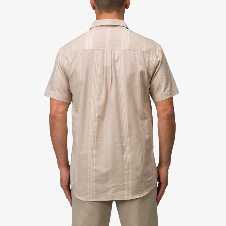 Back view of the men's Felton Shirt in taupe, highlighting lightweight, breathable fabric with subtle vertical pattern.