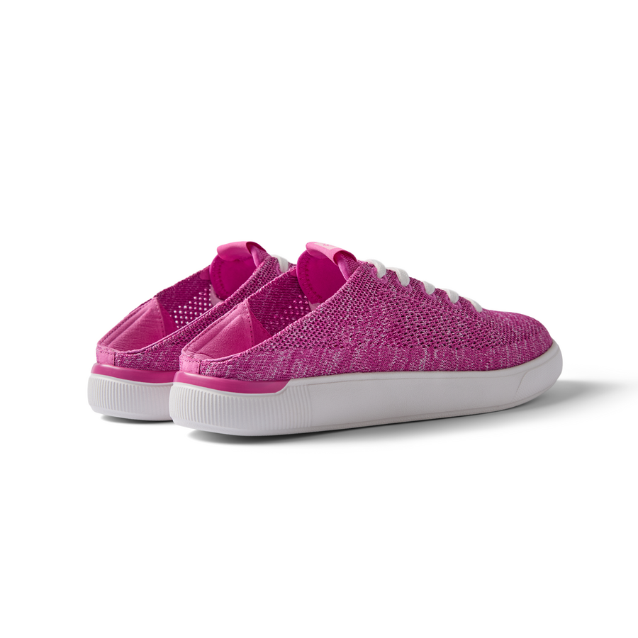 Kids Neptune unisex pink slip-on shoes facing left, showing back and side with soft cushioning and arch support.