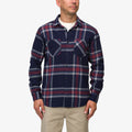 Man wearing a Houston Flannel Shirt in navy with red and gray plaid, front view showing button details and chest pockets.