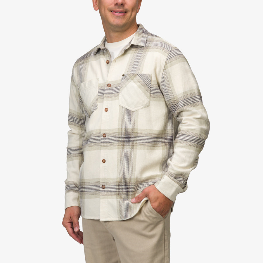 Man wearing Houston Flannel Shirt in almond milk color, front view showing chest pocket and buttons, casual style.
