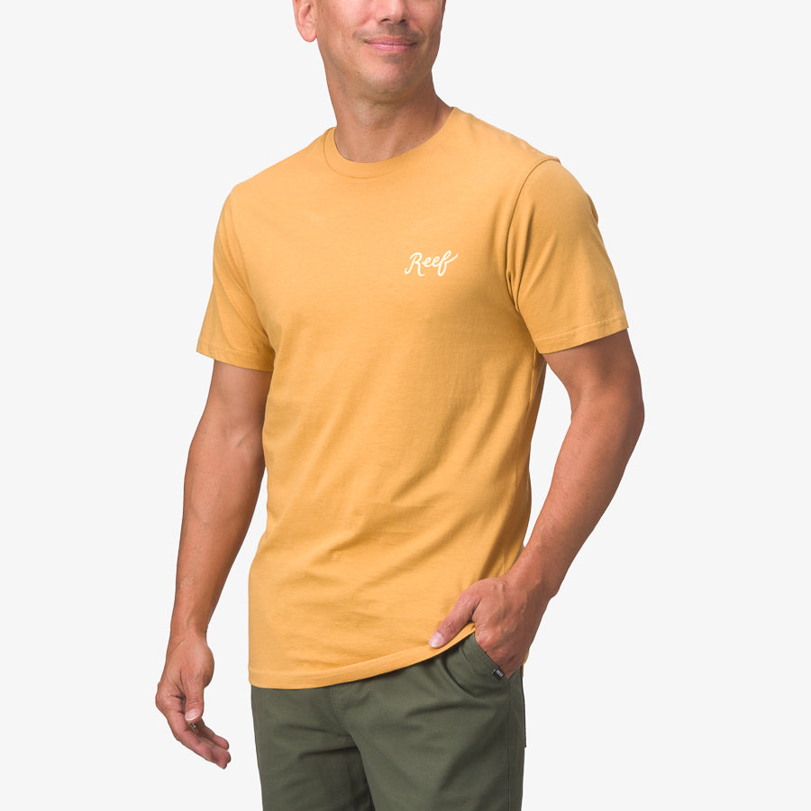 Man modeling a honey mustard Jacob Tee facing forward, highlighting its surf-inspired, comfortable, beach-ready style.