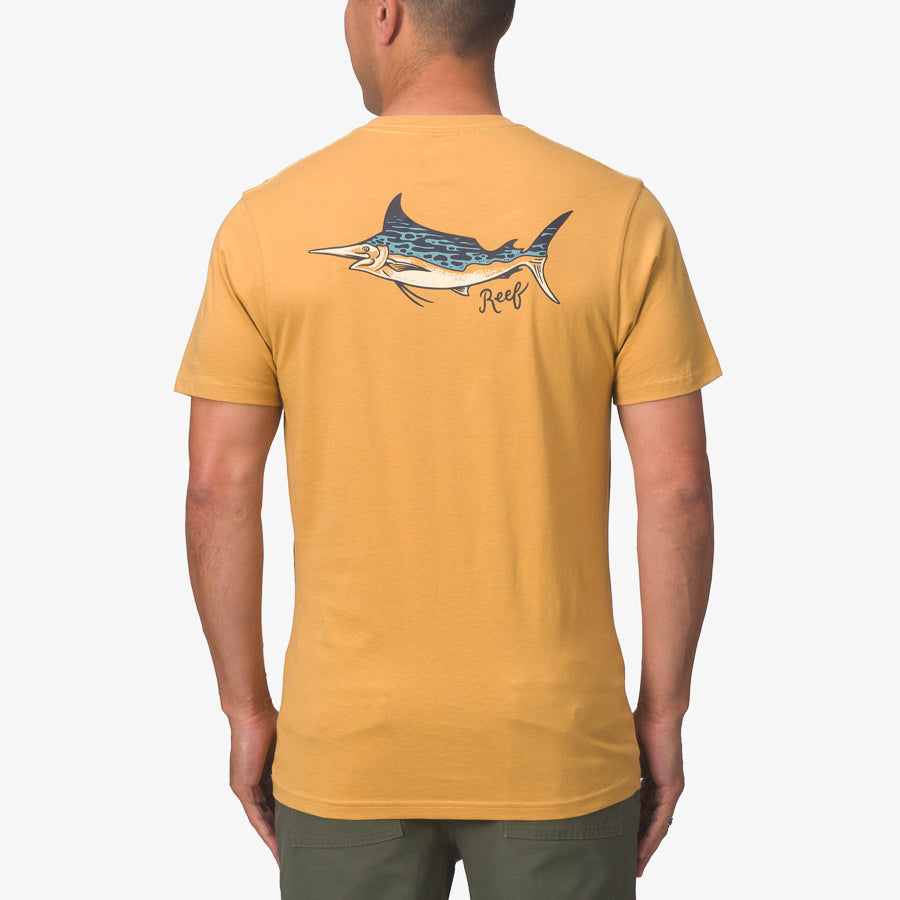 Man wearing a honey mustard Jacob Tee showing back with a marlin fish graphic, surf-inspired comfort apparel for men.
