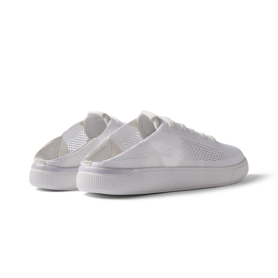 Kids Neptune white slip-on shoes facing back right showing soft-rebound cushioning and breathable upper mesh design.