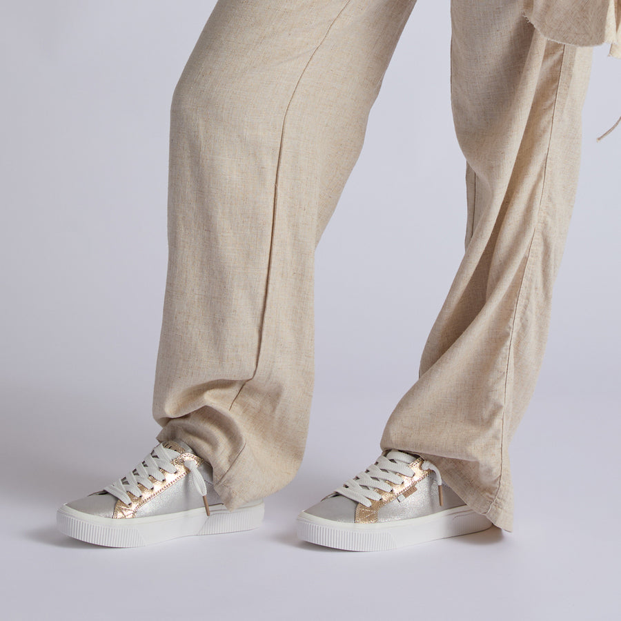 Lay Day Dawn sneakers facing forward in marble silver, highlighting comfort features and surf-inspired style for women.