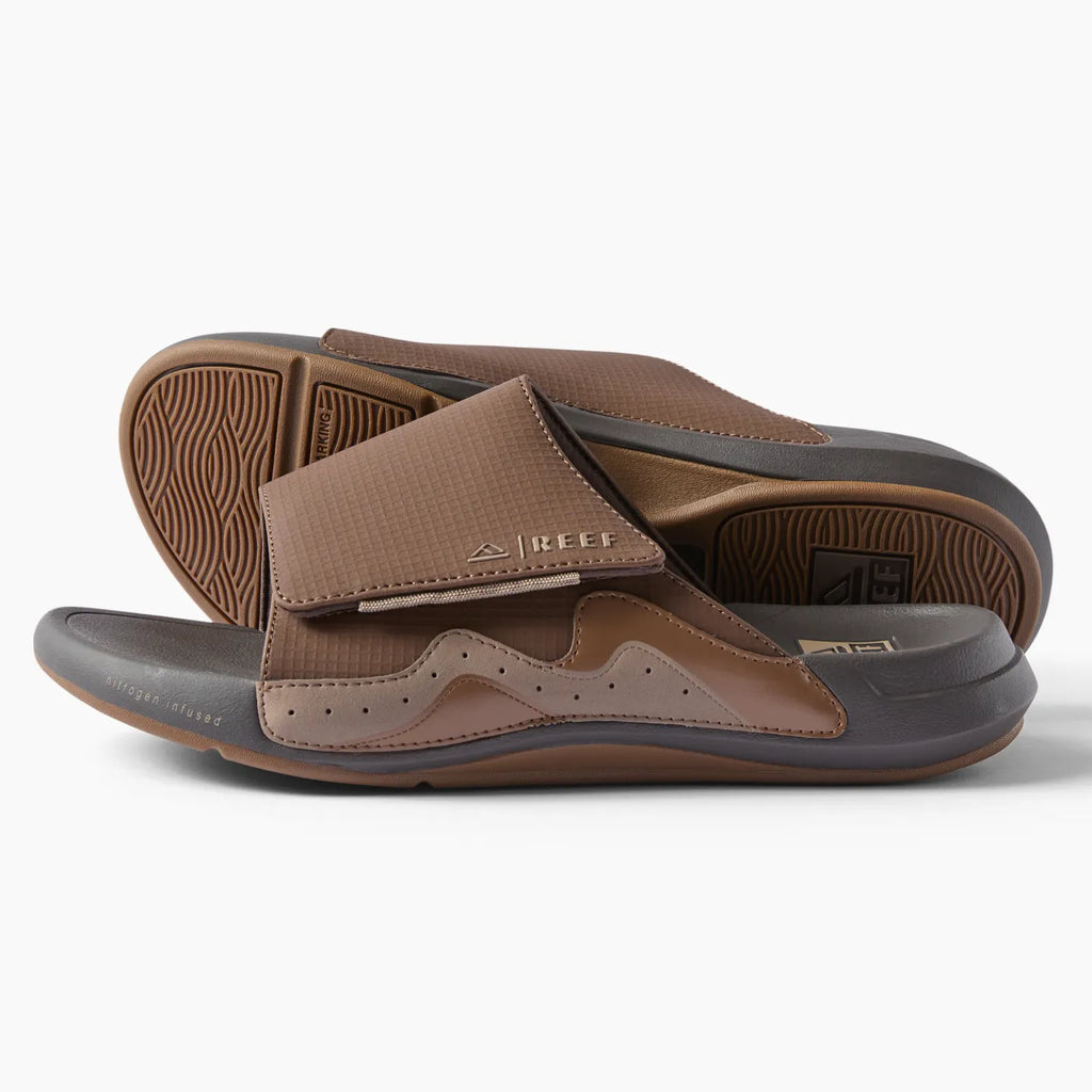 Side view of brown Cruiser Slide men's slide sandal with anatomical arch support and cushioned footbed