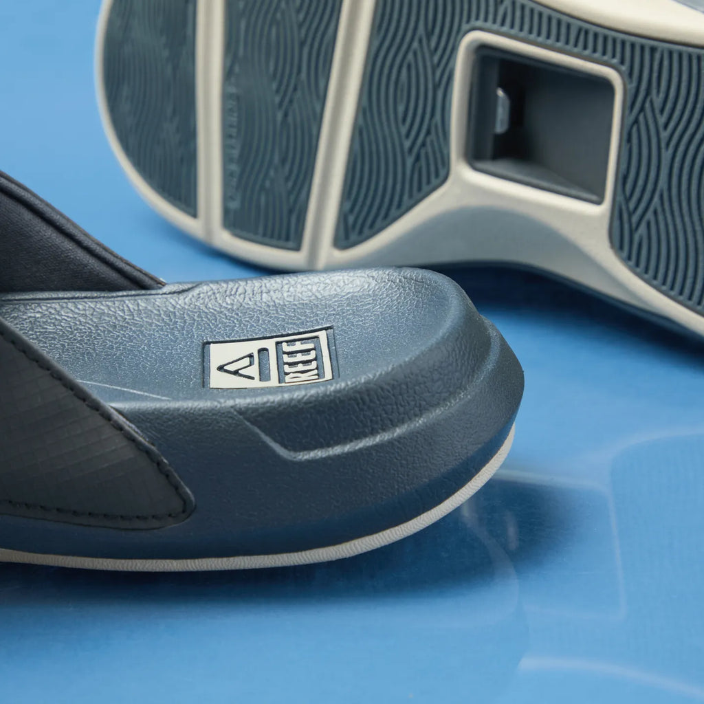 Close-up of the front and sole of the deep grey Cruiser Slide facing right, featuring water-friendly, cushioned comfort.