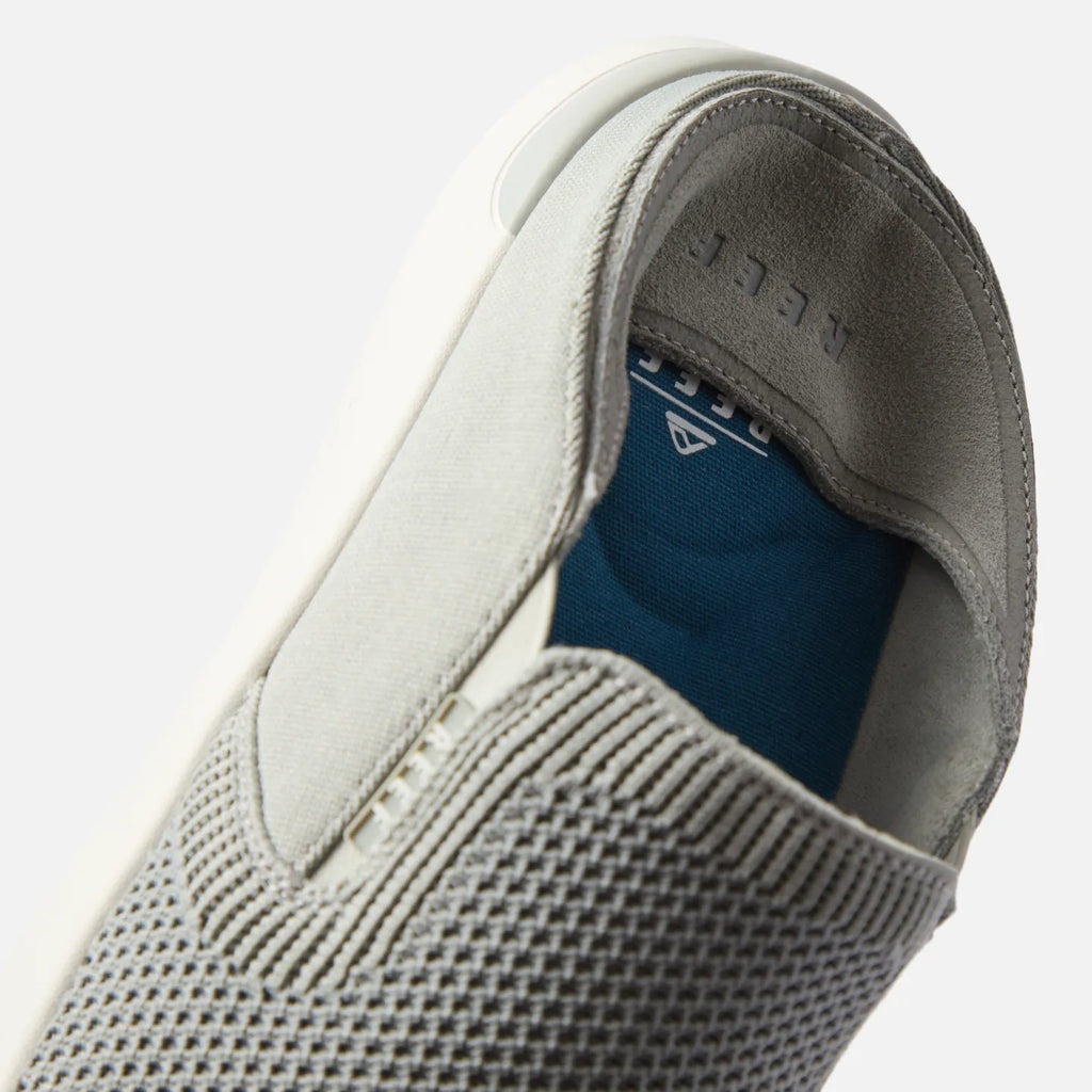 Close-up of the front and inner side of the Neptune Slip-On in off grey, showing soft-rebound cushioning and arch support.
