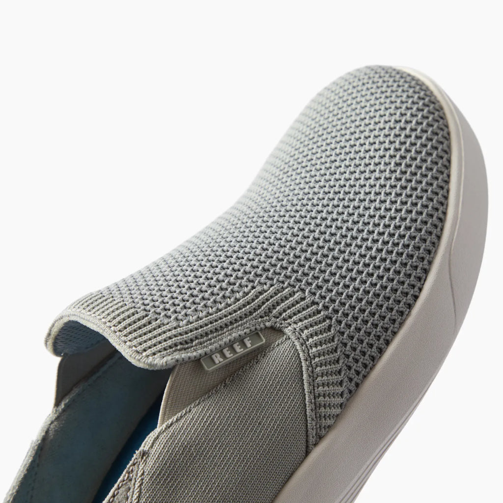 Neptune Slip-On facing right, close-up of breathable grey mesh upper with soft-rebound cushioning and arch support.