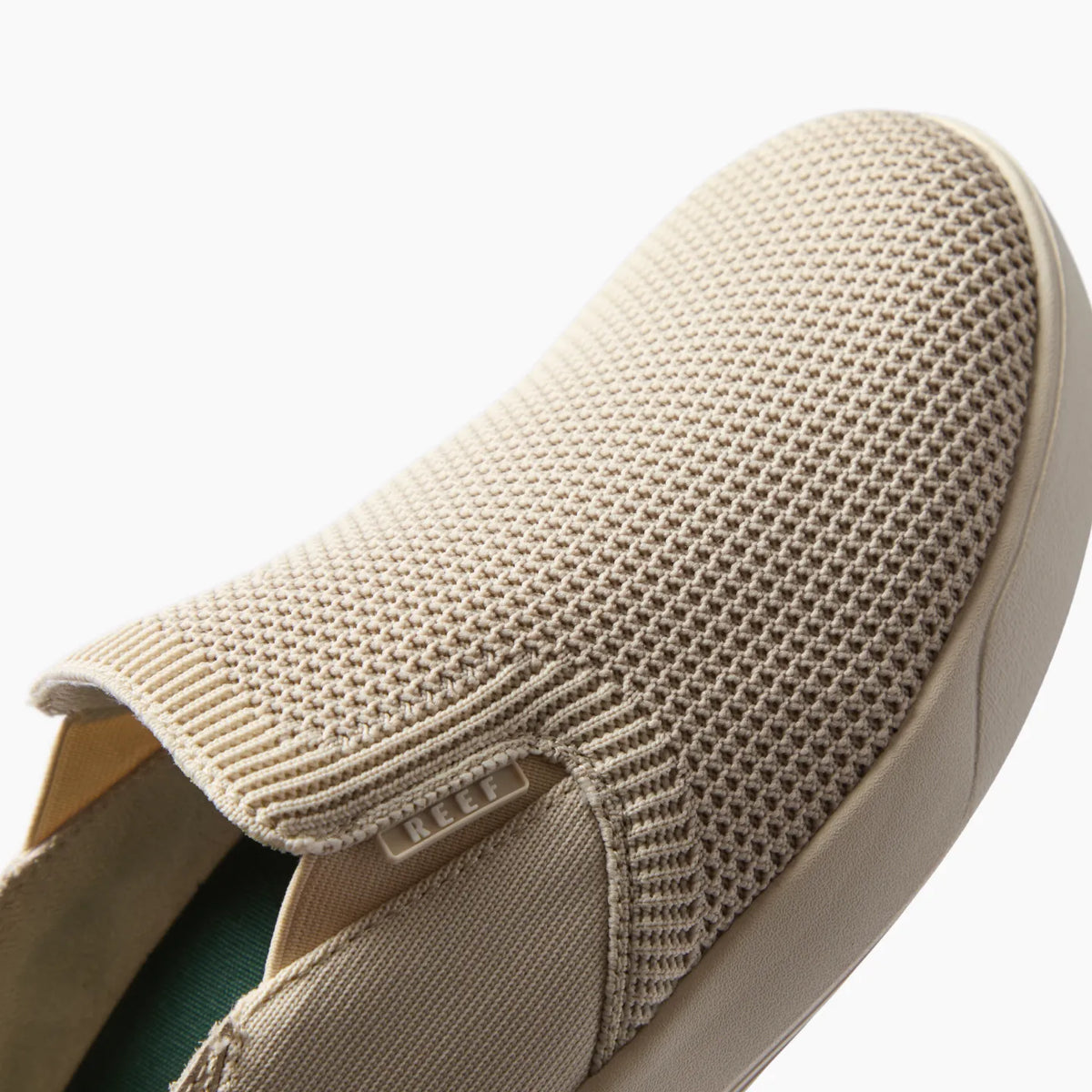 Neptune Slip-On shoe facing left, close-up of the front and knit upper highlights comfort and water-friendly design.