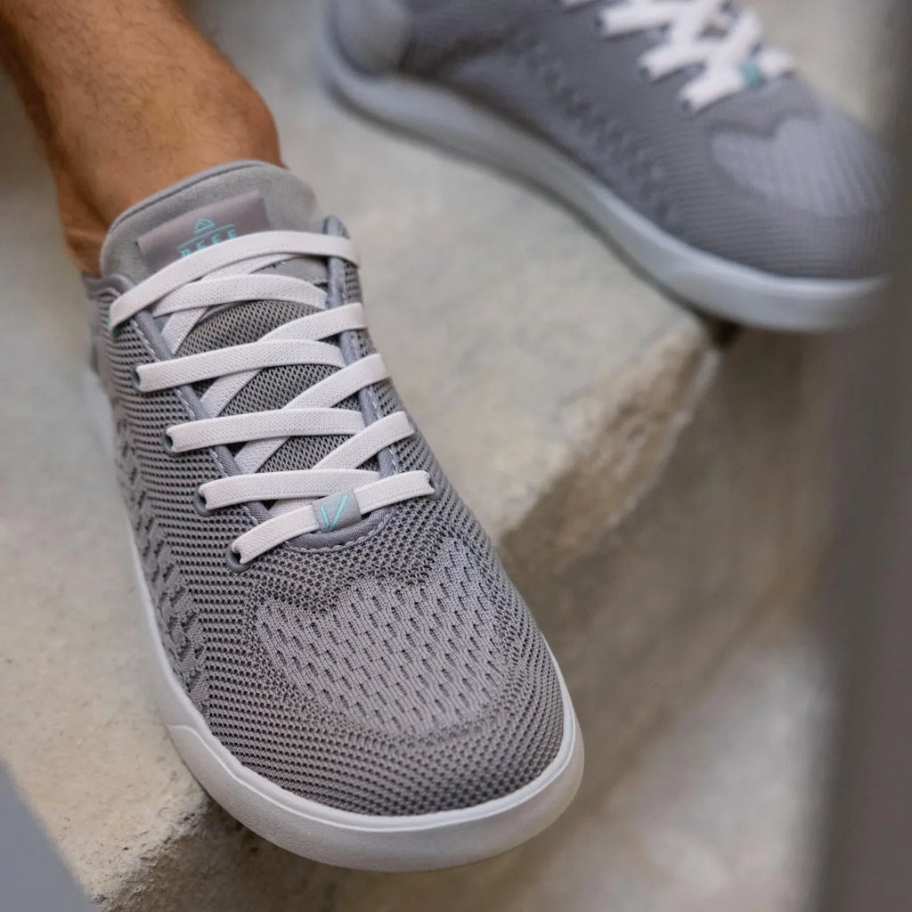 Neso shoe in grey facing forward, close-up on mesh upper and soft-rebound cushioned toe area for beach comfort.