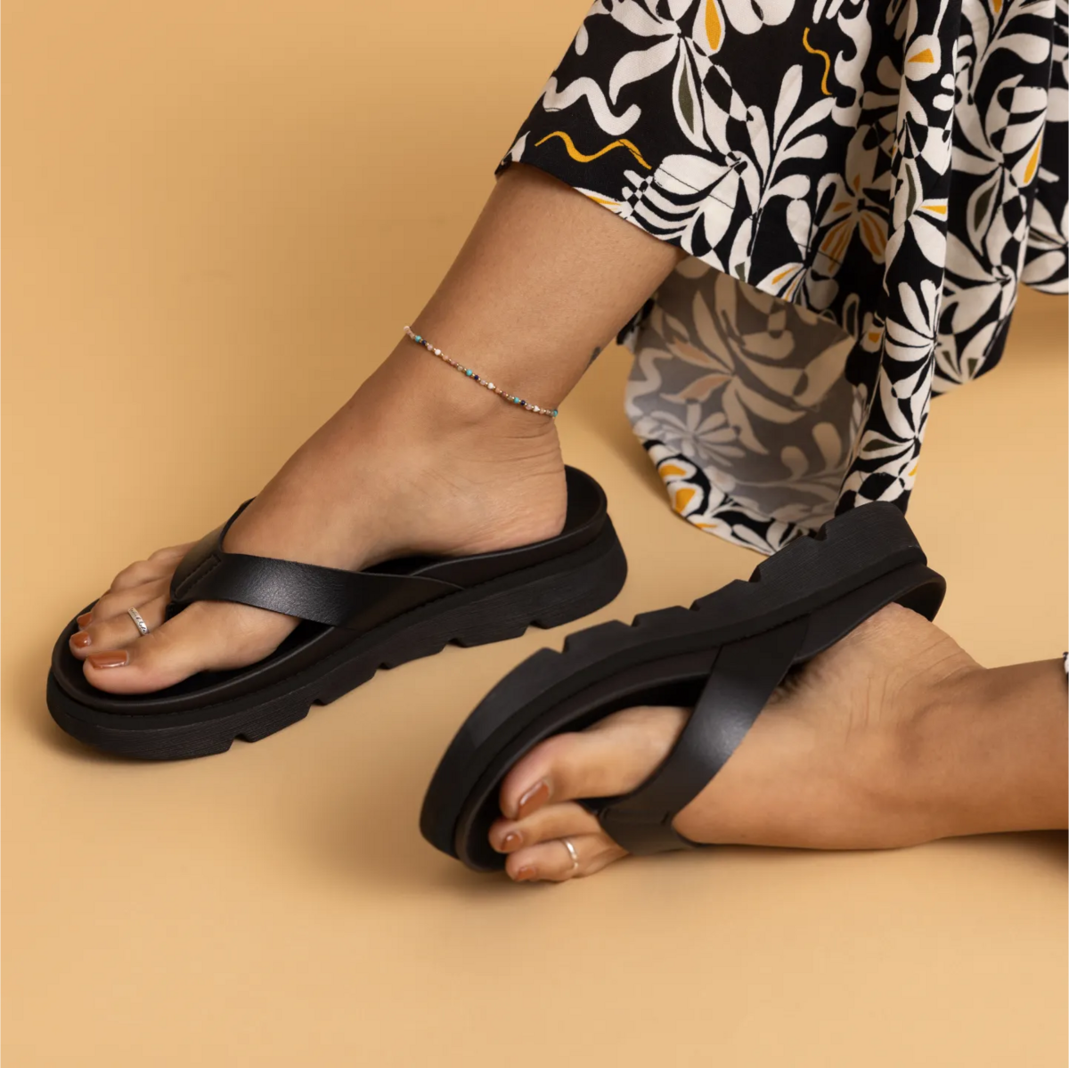 Vista Luxe Vivianahh black sandals on right foot facing forward and left foot showing sole, comfort-focused beach footwear for women.