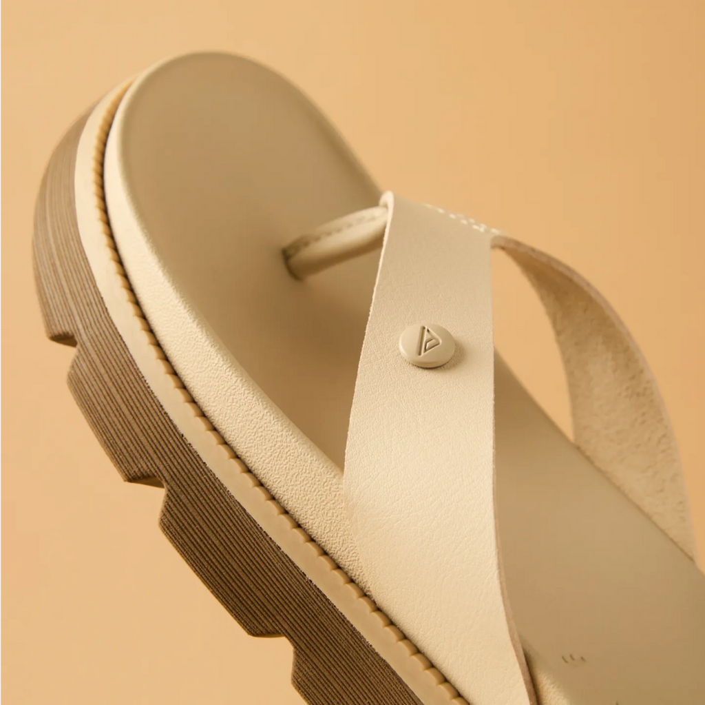 Vista Luxe Vivianahh sandal close-up of beige toe post and cushioned insole facing left, highlighting comfort and durability.