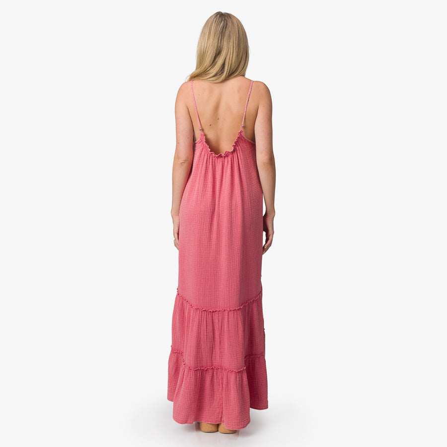 Woman wearing Lainey Maxi Dress in mauve wood wash, back view, showing adjustable straps and relaxed fit for beach comfort.