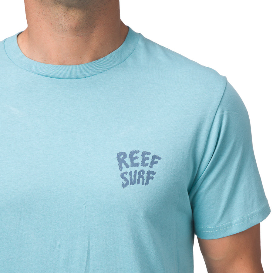 La Loca Tee in light blue with REEF SURF logo, men’s beach-inspired apparel designed for comfort and durability.