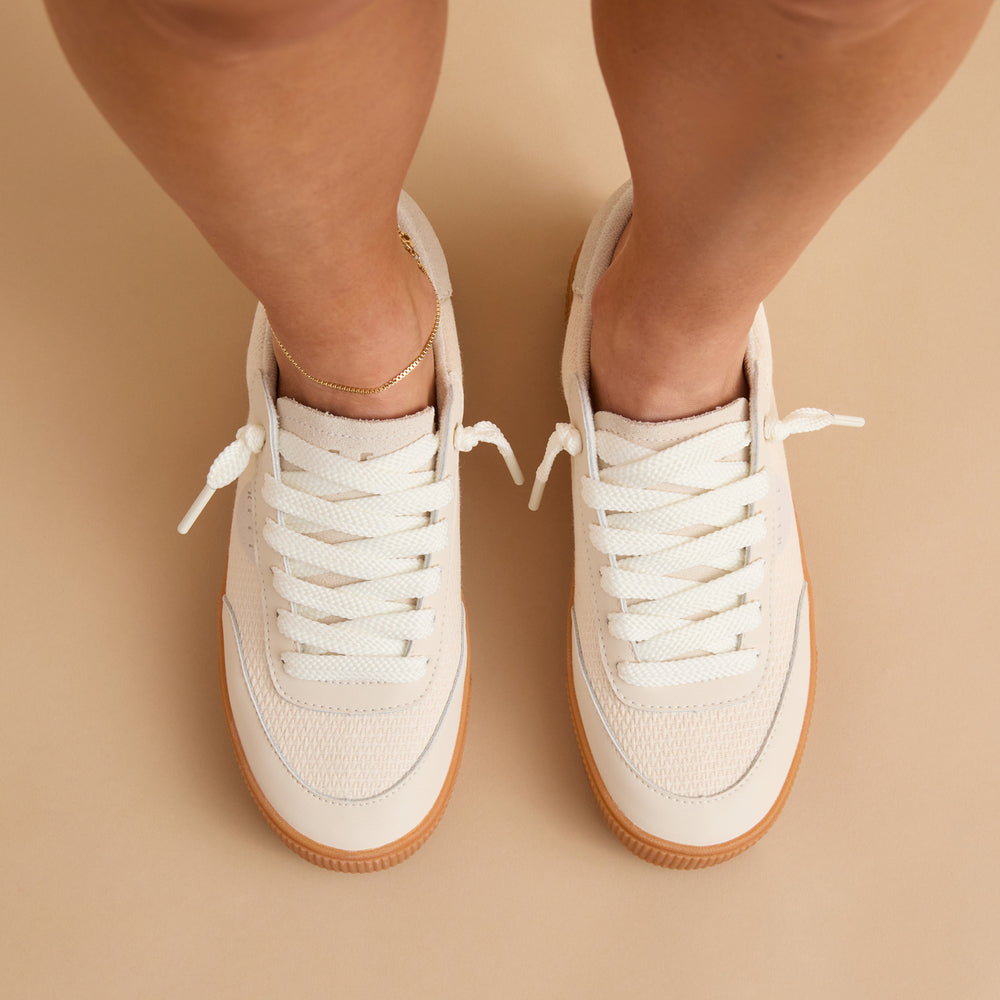 Top view of women's Lay Day Seas sneakers in vintage white with tan soles, featuring comfort and arch support.