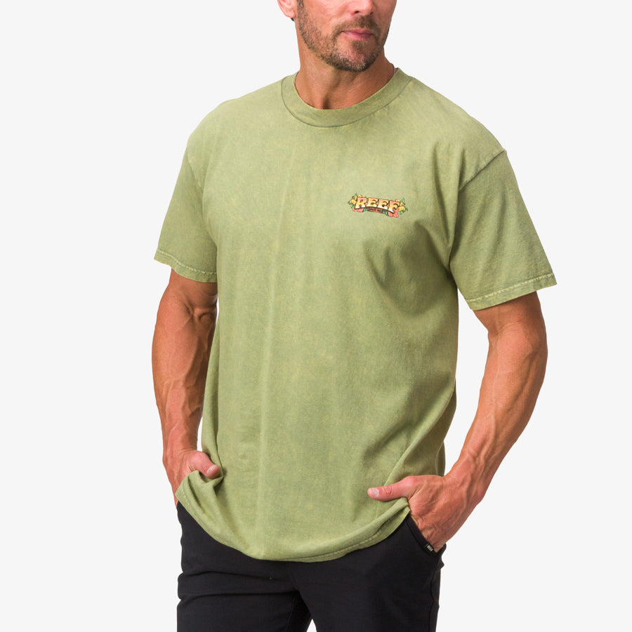 Men’s Lonnie Tee in moss stone mineral wash facing forward showing chest logo, beach-inspired comfortable apparel.