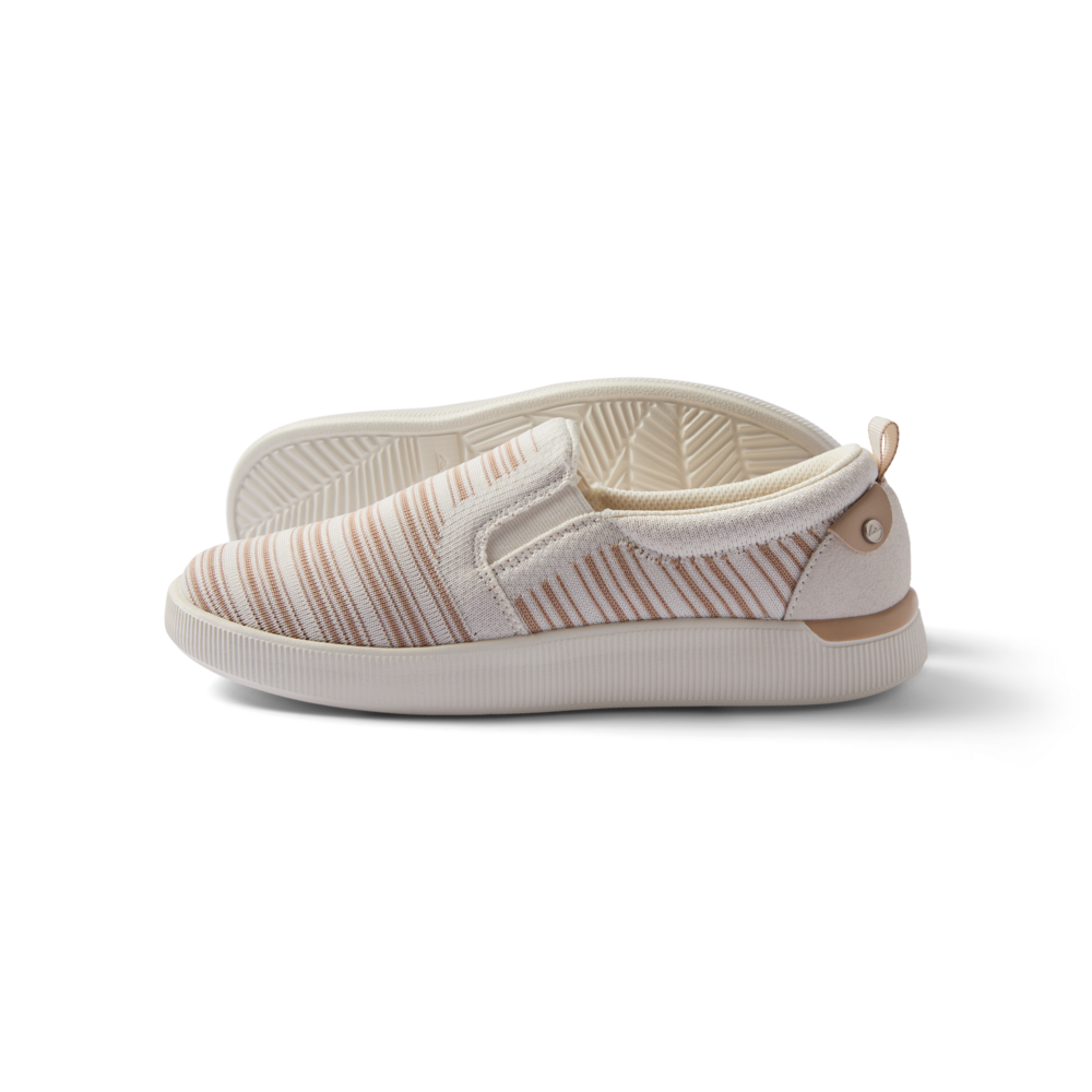 Neptune Elyse women's slip-on sneaker facing left, close-up side view with soft cushioning and arch support, beach-inspired design.